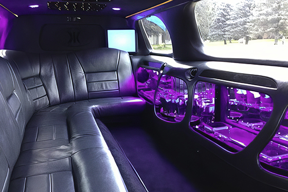 inside a stretch Lincoln Town Car